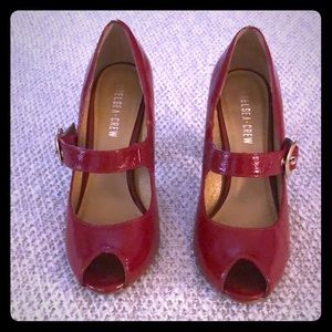 Women’s red patent leather peep toes